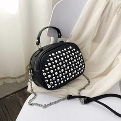 A black bag with silver studs on it

Description automatically generated