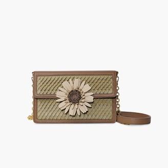 A purse with a flower on it

Description automatically generated