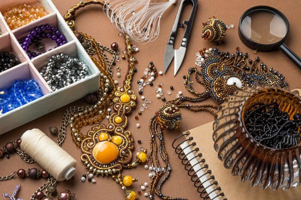 high-angle-essentials-bead-working-with-scissors-thread_23-2148815808