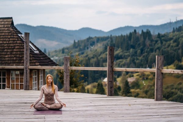 woman-sitting-lotus-position-morning-fresh-air_1153-4924